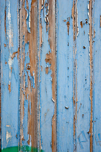 istock Peeling blue painted wooden door panel 184612750