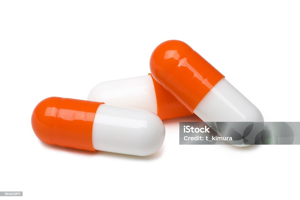 Capsules Capsules on white. Capsule - Medicine Stock Photo