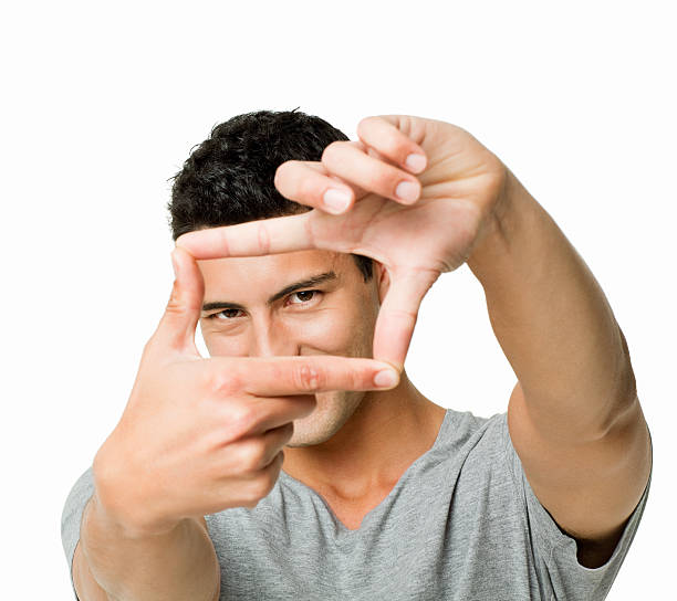 Man Making a Finger Frame - Isolated Handsome young man gestures a finger frame with his hands. Horizontal shot. Isolated on white. hand cropping photos stock pictures, royalty-free photos & images
