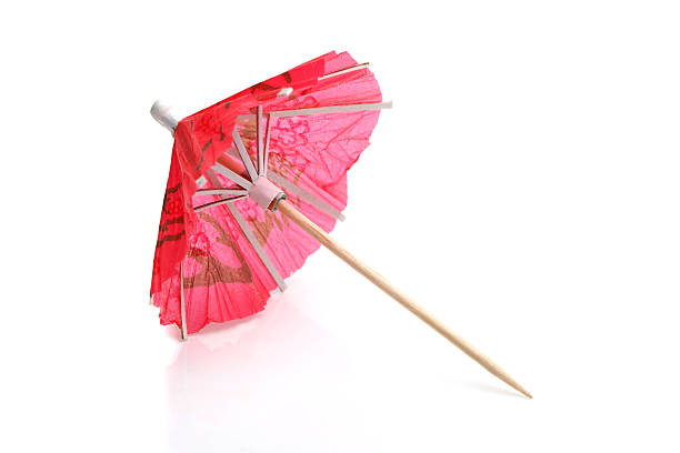 Cocktail umbrella Cocktail umbrella on a white background drink umbrella stock pictures, royalty-free photos & images