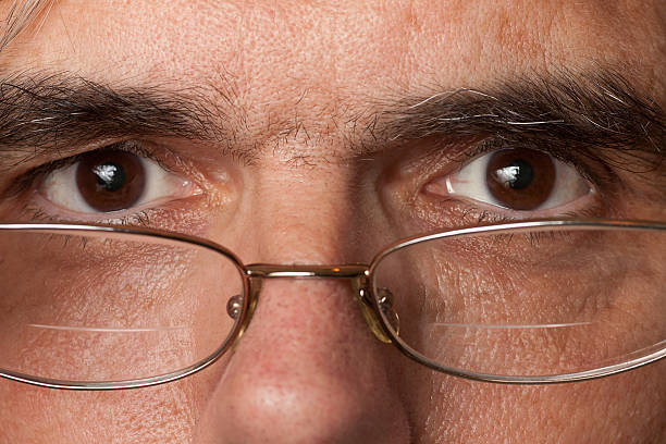 istock Face Close Up with Eyes Focused, Tired and Stressed 184613535