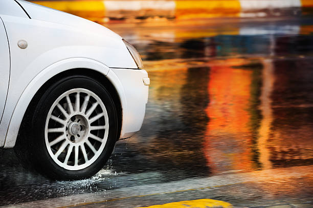 istock Motion blurred car driving in rain 184613573