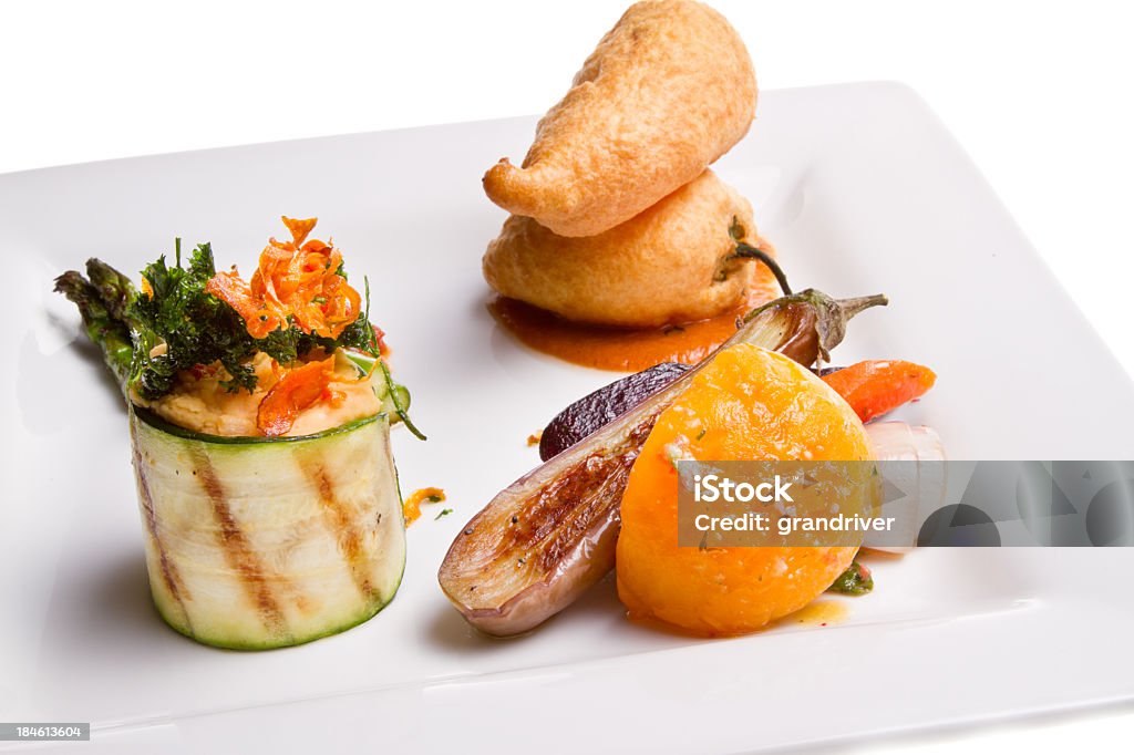 Gourmet Vegetarian Plate Gourmet Vegetarian Plate with Chili Rellenos, asparagus, squash, tomato, sauce, and garbanzo beans Appetizer Stock Photo