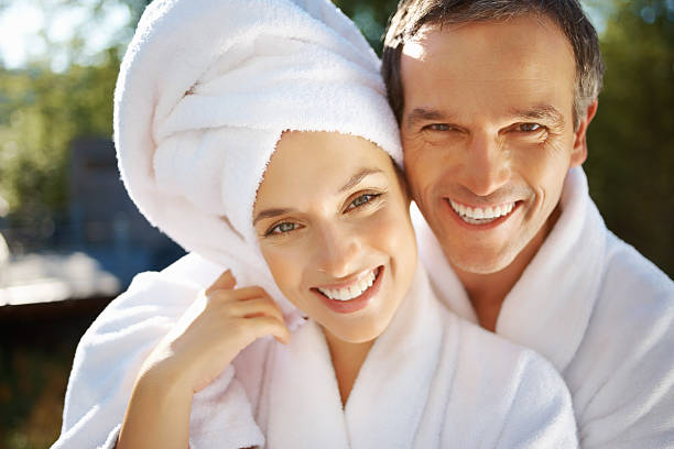 istock Loving couple in bathrobes at spa 184613720