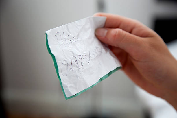 Man’s finger pointing at note taped on wall: VOTE!