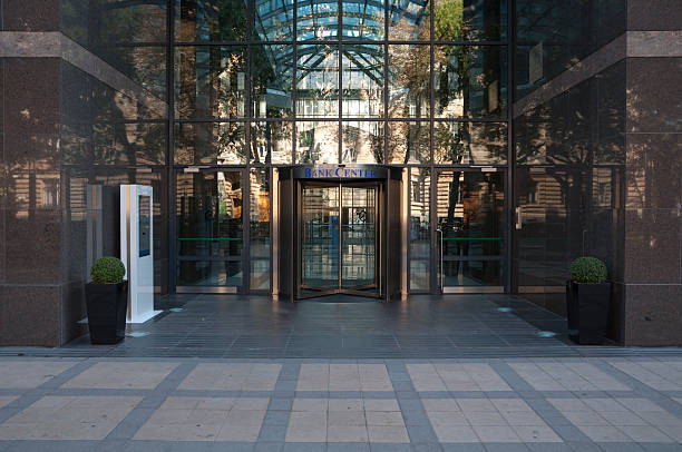 Glassy bank center with reflections from outside Bank center bank entrance stock pictures, royalty-free photos & images