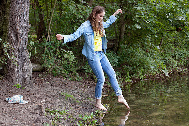 Young man nearly falls in water