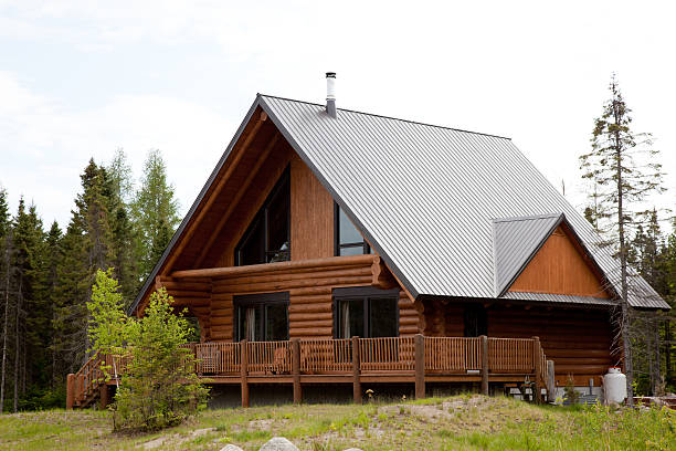 Wooden Cottage, Log Home, Log Cabin Large wood and stone log home surrounded by a forest sod roof stock pictures, royalty-free photos & images