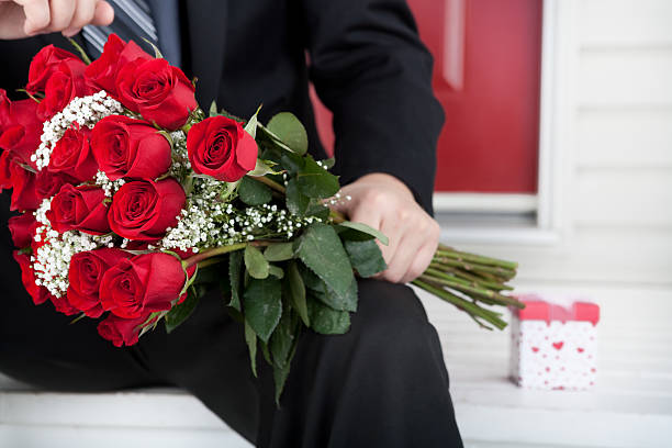 istock Adult holding roses and present for Valentine's Day 184614810