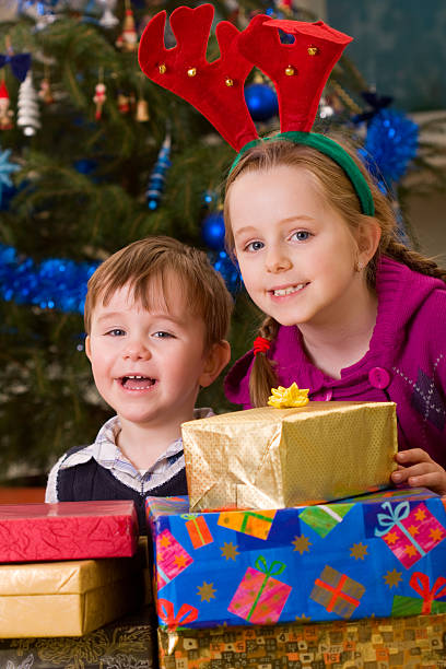 istock Children with christmas gifts 184615013