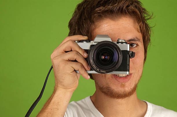 istock analog photo machine and young photographer 184615039