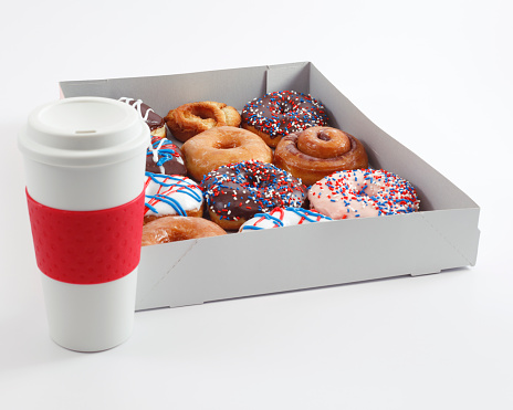 Box of donuts and cup of coffee