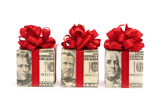 Money Gift—Bills Wrapped in Red Bow, Ribbon on White