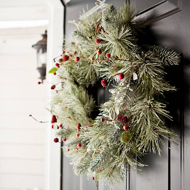Winter wreath Holiday wreath on a door. wreath photos stock pictures, royalty-free photos & images