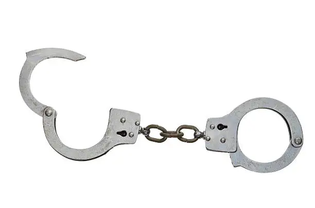 A set of handcuffs, isolated on white.