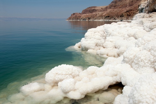 Salted Water in the Dead Sea with salt crystals (Jordan)