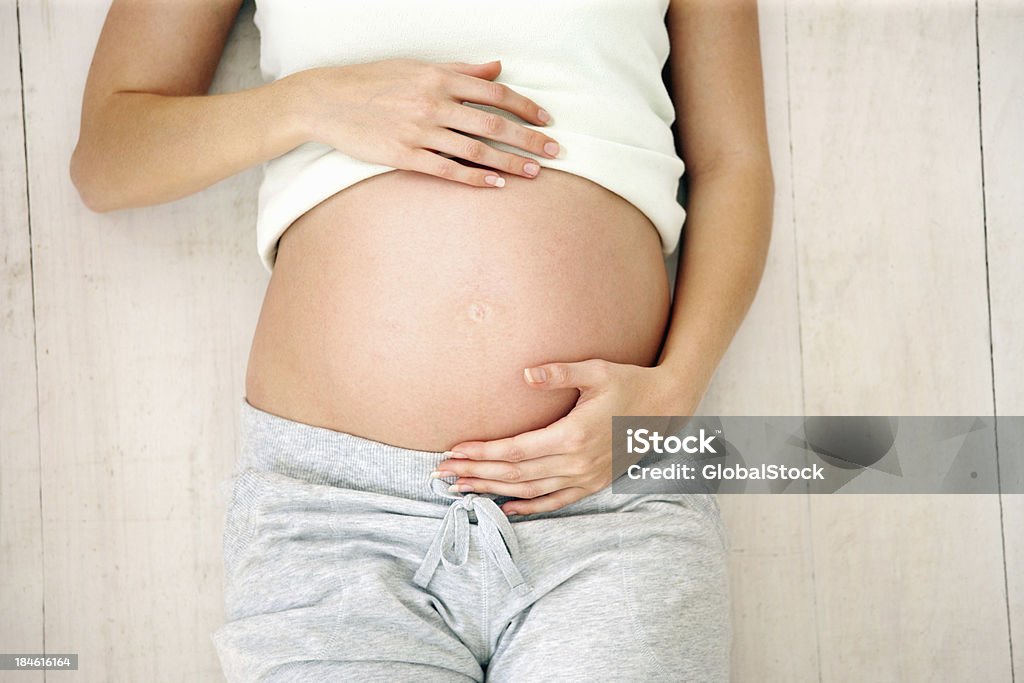 Pancia incinta - Foto stock royalty-free di Incinta