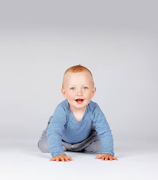 istock Adorable baby boy crawling 184616193