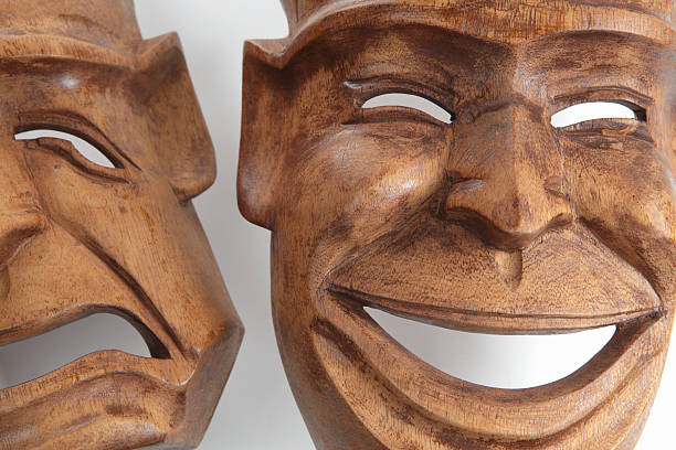 istock Comedy and tragedy wooden masks on white background 184616197