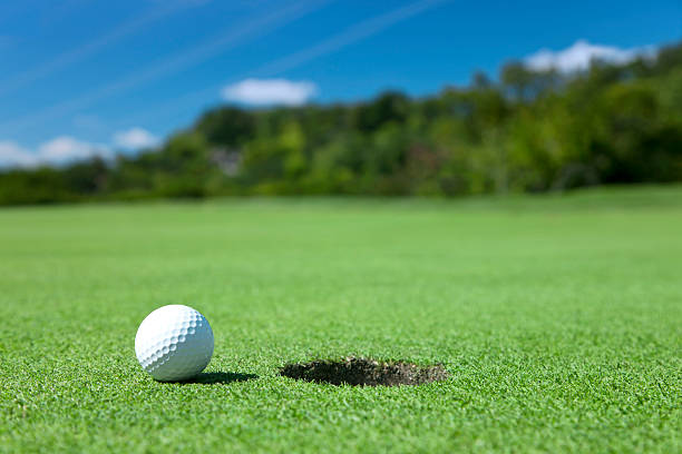 istock Golf Ball On Edge of Hole 184616706