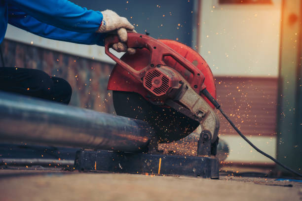 istock Welding machine iron metal sparking. Hot flame welding metal work cutting fire iron workshop. Locksmith using Welding machine cutting metal processing grinder. Close up hands Sparks in metalworking 1846168229