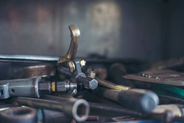 istock Mechanic tools engineering equipment car auto repair shop with copy space. Blurred background mechanical service. Heavy screw grungy rusted wrenches dirty screwdriver object. Industrial hardware set 1846169819