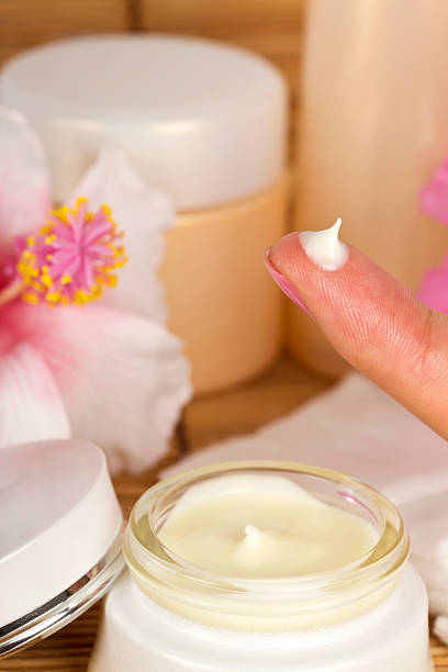 istock Drop of face cream on a finger 184617801