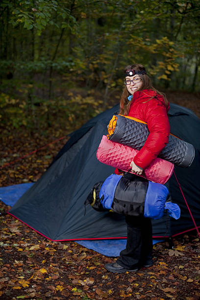 istock Camping Girl with equipment and tent 184618244