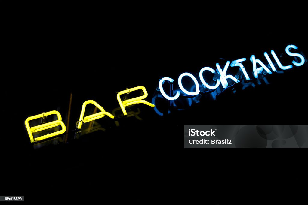 Neon bar cocktails yellow and blue lights of an international open bar After Work Stock Photo