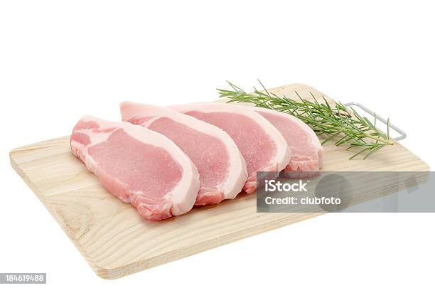 Pork Loin Steaks On A Wooden Cutting Board Stock Photo - Download Image Now - Boneless Meat, Butcher's Shop, Close-up