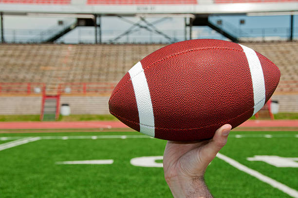 istock Hand holding football 184620188
