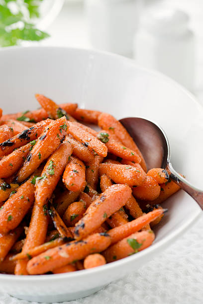 istock Grilled Herbed Baby Carrots Vertical 184620475