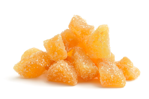 Crystallized ginger isolated on a white background.
