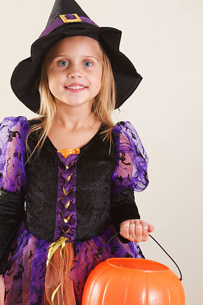 istock Girl in Halloween Witch Costume 184620488