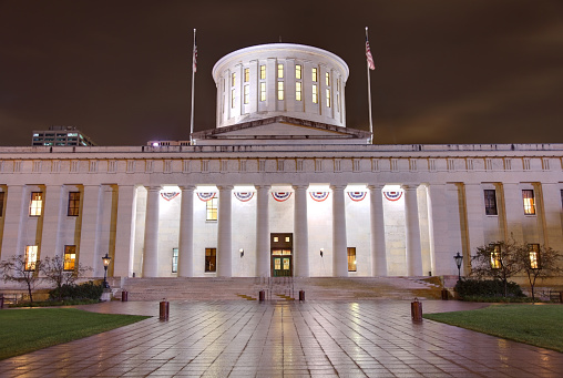 The Ohio Statehouse, located in Columbus, Ohio, is the house of government for the state of Ohio. The Greek Revival building houses the Ohio General Assembly and the ceremonial offices of the Governor, Lieutenant Governor, Treasurer, and Auditor. Columbus is the capital and largest city in Ohio