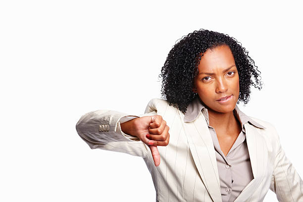 thumb'hacia abajo - businesswoman black african descent studio shot fotografías e imágenes de stock