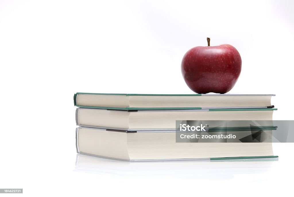 Books anf red apple "Books stack, apple and open books on white. See more::::" Accessibility Stock Photo
