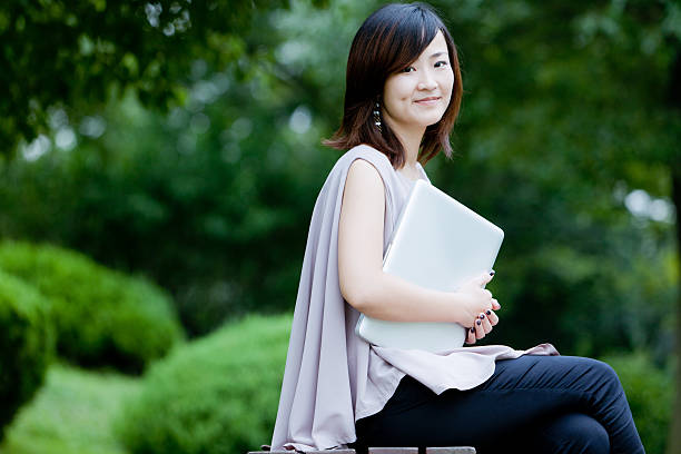 istock chinese businesswoman use laptop 184622819