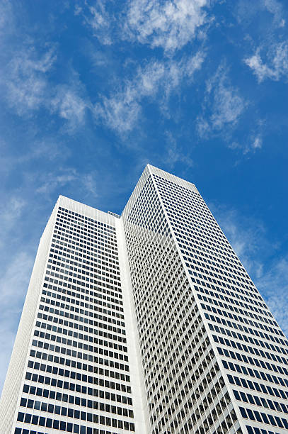 istock Modern White Office Tower Blue Sky Business Background 184622886