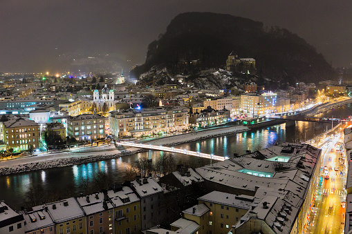 Night view of Salzburg and the Salzach River after a snowfall. Salzburg, Austria. Canon EOS 5D Mark II