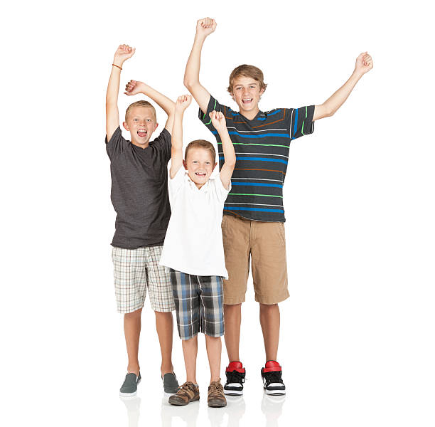 istock Portrait of three boys cheering 184623877