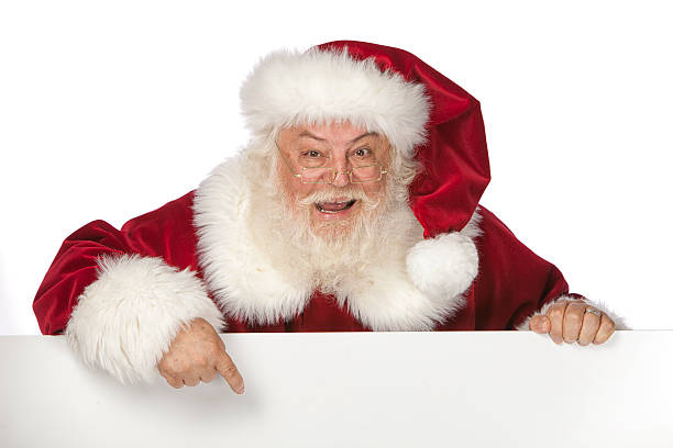 Imágenes reales de Santa Claus sosteniendo un cartel en blanco - foto de stock