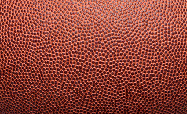 Football Pigskin Background Texture Pigskin texture from an American football. Great background for type and images. american football ball photos stock pictures, royalty-free photos & images