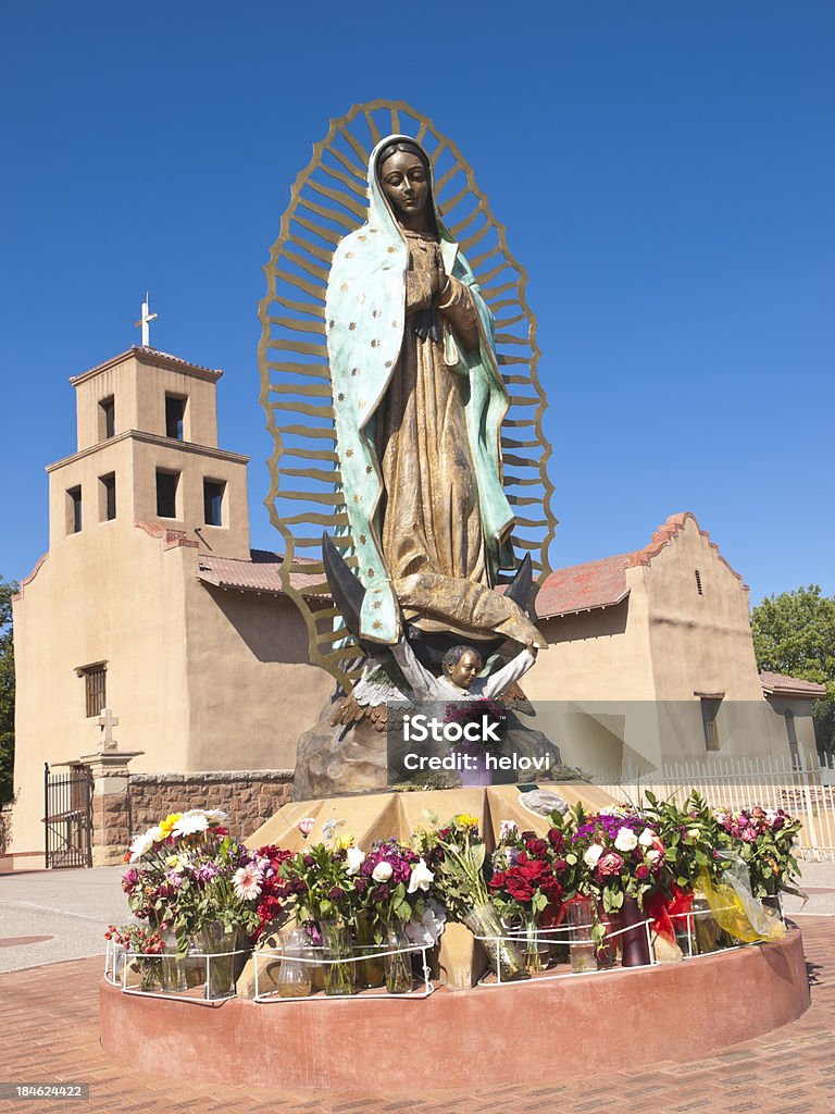 Our Lady of Guadalupe Shrine "A Shrine of The Roman Catholic Archdiocese of Santa Fe NM, in front statue of Virgin Mary. Church is built in 1781, just west of the Santa Fe Plaza, the historic El Santuario de Guadalupe church is now an art and history museum." Virgin of Guadalupe Stock Photo