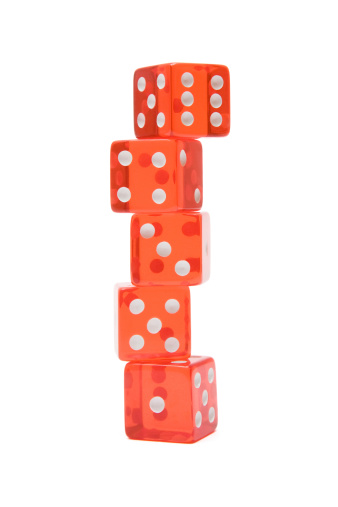 Stack of five red dice isolated on a white background.