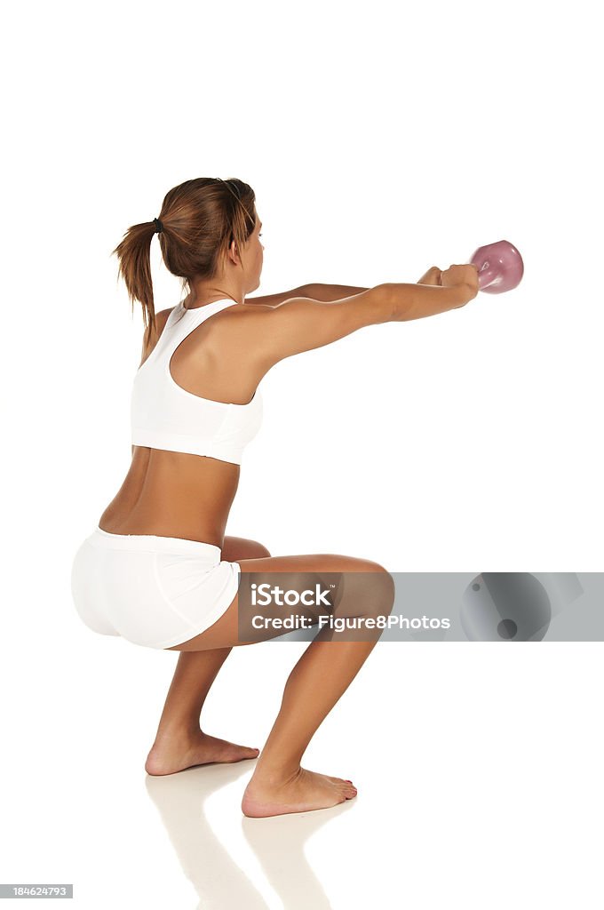 Kettleball feminino - Foto de stock de Agachando-se royalty-free