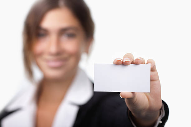 istock Young businesswoman showing card 184625103