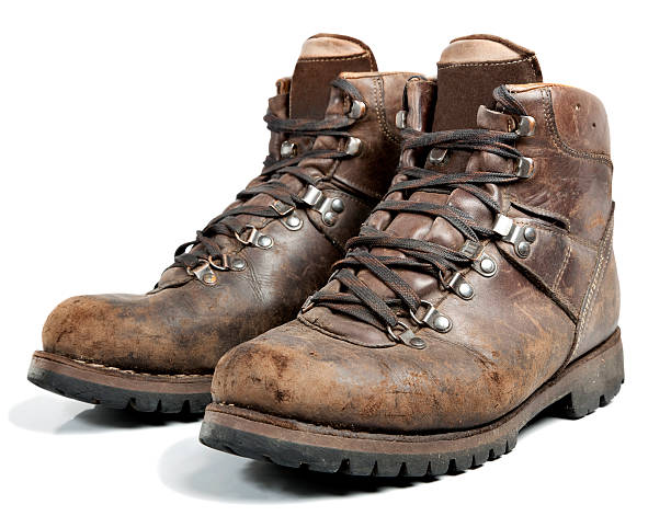 Photo of a pair of old leather hiking boots and laces