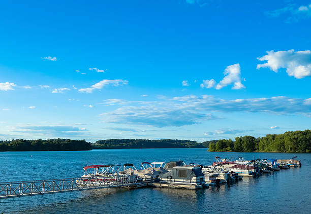 istock Docked Boats on a Lake Under a Brilliant Blue Sky 184625409