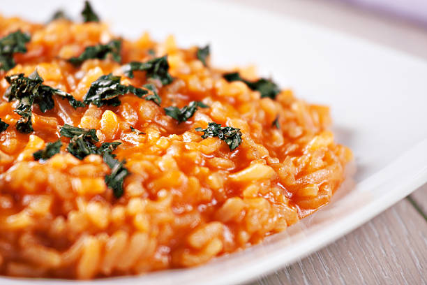 Risotto with tomatoes Risotto with tomatoes tomato rice stock pictures, royalty-free photos & images